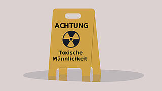 Aufsteller mit Aufschrift Achtung toxische Männlichkeit